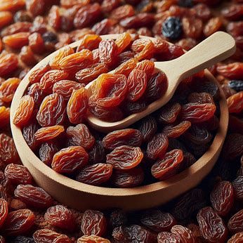 a bowl of raisins with a spoon